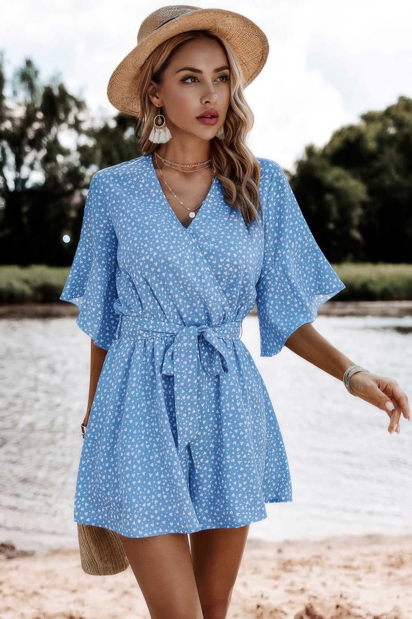 Polka dot romper with V-neck, flutter sleeves, tie belt, and flared shorts - fashion by SplendorAmoris