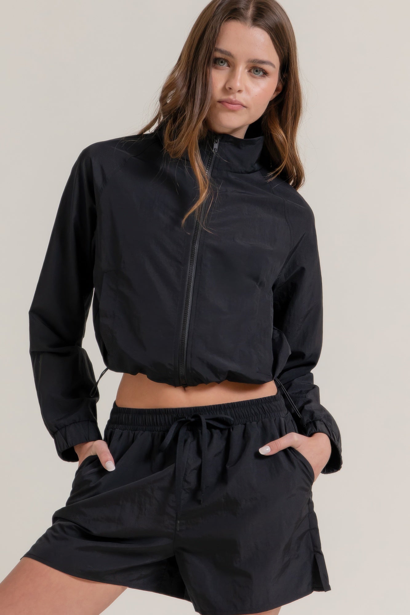 Women's crop anorak active jacket with long sleeves, zip front, drawstring hem, and relaxed athletic silhouette - SplendorAmoris