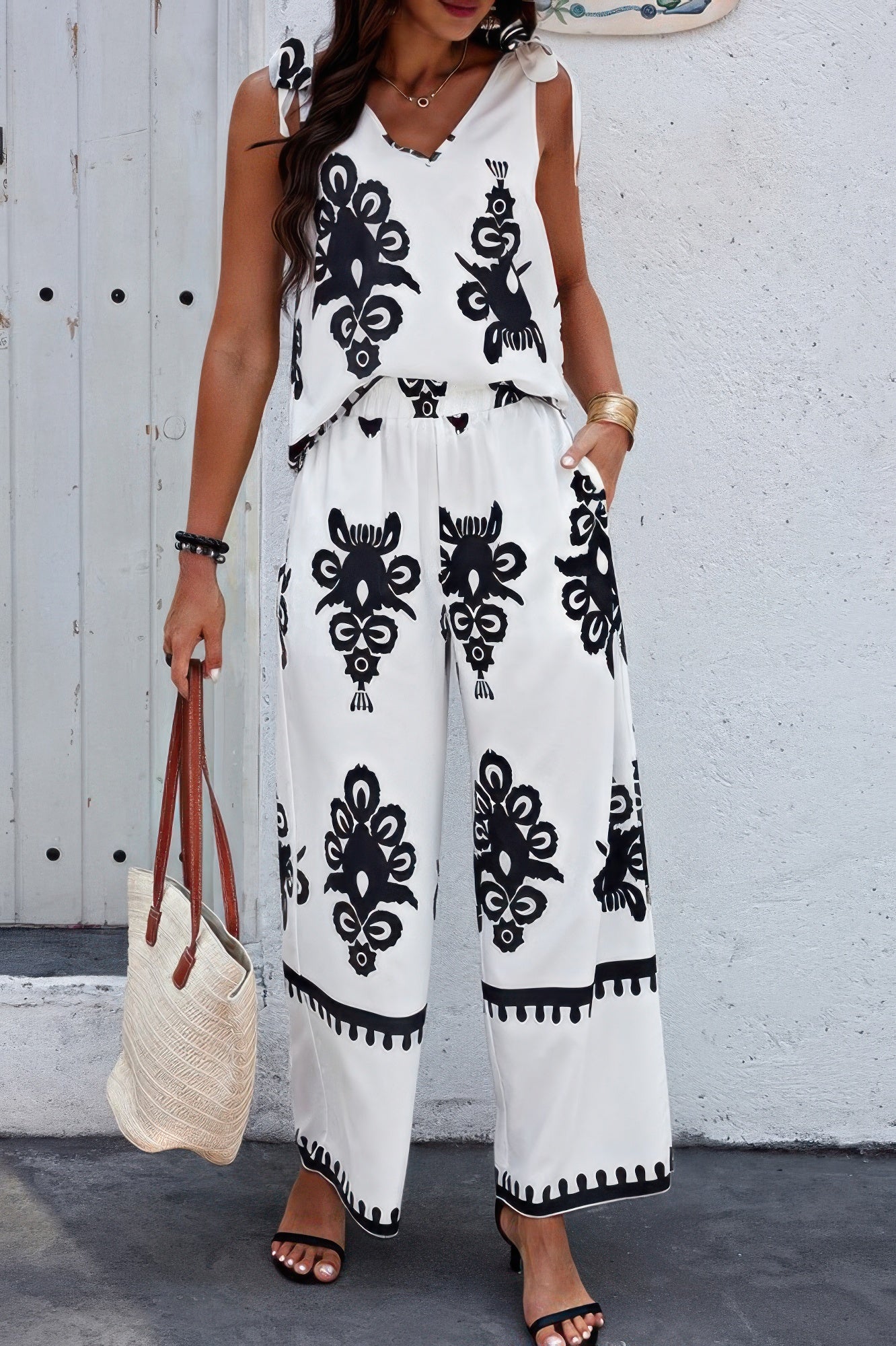 Women's floral knot shoulder tank set with V-neck top, sleeveless design, elastic waist pants, wide legs, and printed pattern - SplendorAmoris